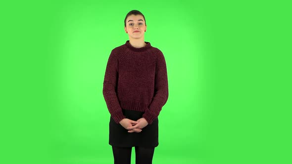 Girl Listens Carefully To Boring Information. Green Screen alt