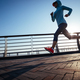 Fitness woman runner running on seaside bridge - PhotoDune Item for Sale