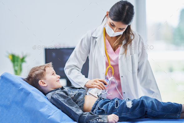Little boy having USG examination by pediatrician - Stock Photo - Images