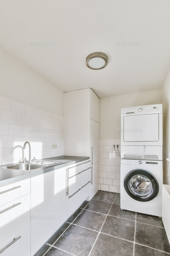 Laundry room with washer and dryer - Stock Photo - Images