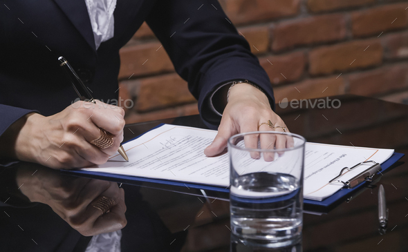 Businesswoman signing job contract
