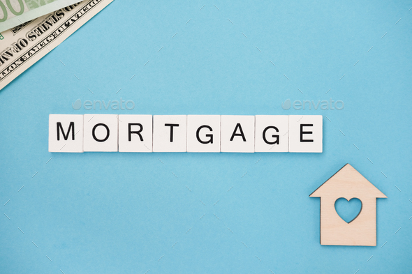 Mortgage spelled out in wooden letter tiles - Stock Photo - Images