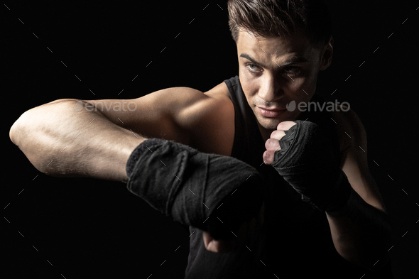 Sportsman man in boxing wraps