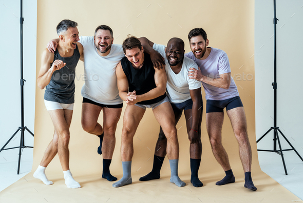 Group Of Multiethnic Men Posing For A Male Edition Body Positive Beauty