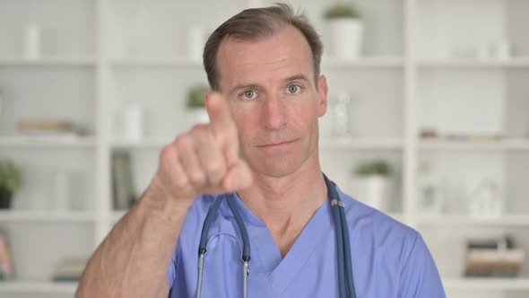 Portrait of Middle Aged Doctor Showing Call Me for Help Sign  alt