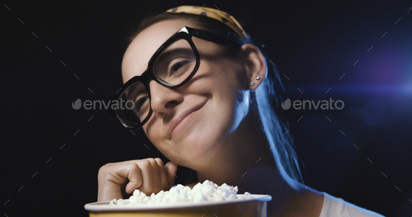 Woman watching a movie at the cinema