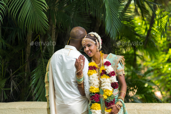 December 8, 2019.Mauritius.The bride and groom in national Mauritian outfits at the Botanical Garden