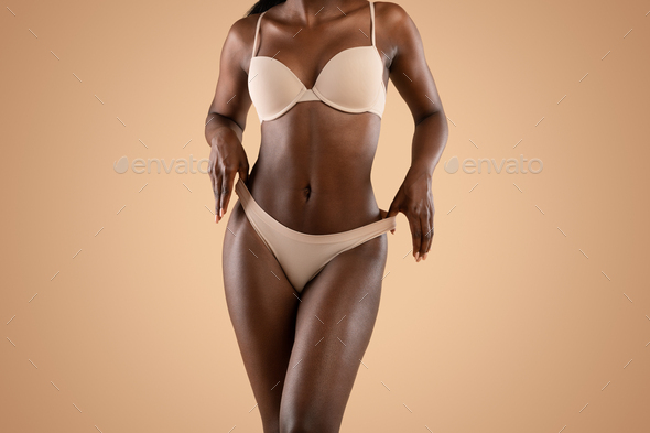 African american woman in underwear demonstrating her perfect body Stock  Photo by Prostock-studio