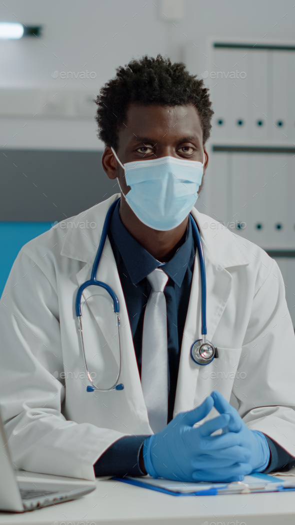 Portrait of african american doctor wearing face mask