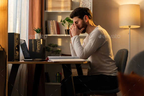 Stressed male entrepreneur having problems at work. Depressed caucasian man sitting upset