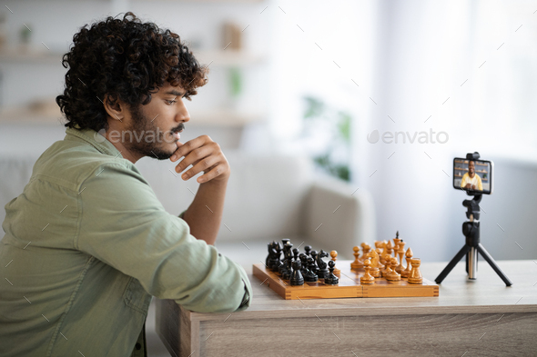 Young Man Playing Game of Chess Online with Friend, Stock Video - Envato  Elements