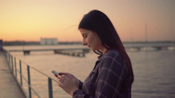 Attracrtive Woman Using Smartphone Walking on Pier Blogger Chatting Outdoor