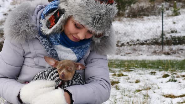 Girl in Winter with Dog Outdoors 