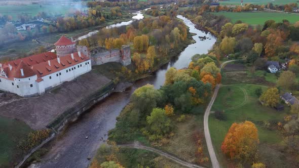 Bauska Medieval Castle Ruins Complex and Park From Above Aerial Shot 4K Video alt