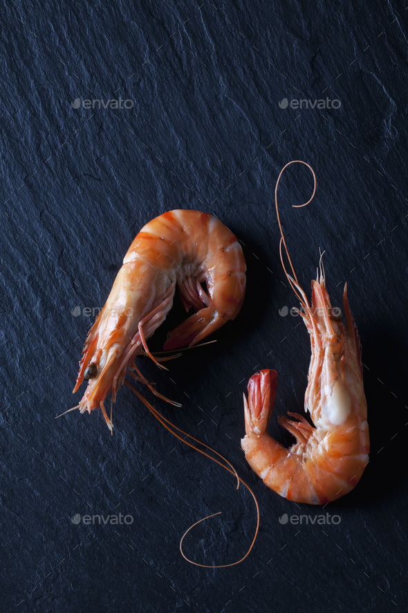 Boiled prawns on black slate - Stock Photo - Images