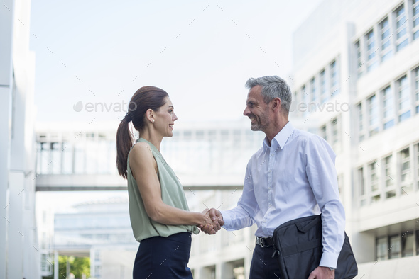 Businesspartners shaking hands - Stock Photo - Images