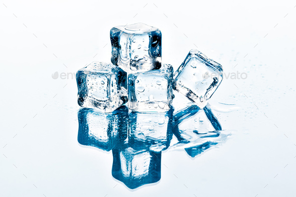 Square melting ice cubes on wet table Stock Photo by FabrikaPhoto