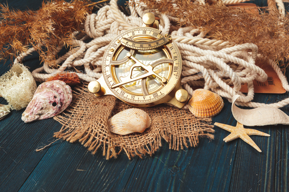 Nautical background. Sailing rope with a compass Stock Photo by