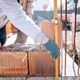 Bricklayer industrial worker installing brick masonry - PhotoDune Item for Sale