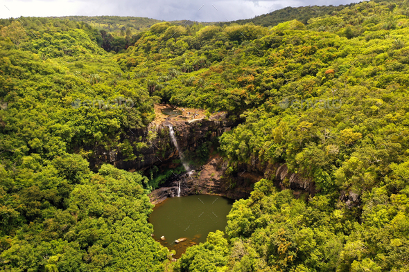 Aerial view from above of the Tamarin waterfall seven cascades in the tropical jungles of the island