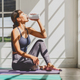 Asian woman drinking after practicing yoga at home on the yoga mats, - PhotoDune Item for Sale