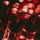 Red alcohol cocktails in shot glasses over red bokeh - PhotoDune Item for Sale