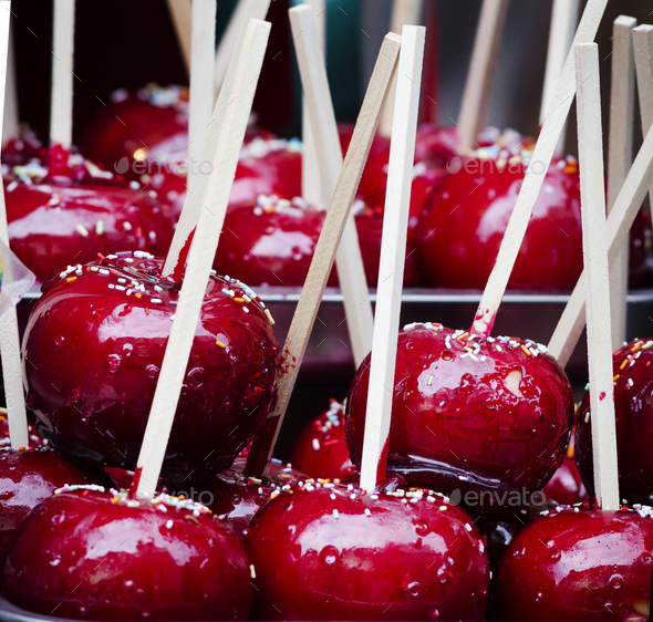 Red candy apple on holiday fair market - Stock Photo - Images