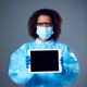 Studio Portrait Of Female Lab Worker in PPE With Face Mask And Safety Glasses Holding Digital Tablet - PhotoDune Item for Sale