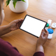 Senior woman with medicines on table using laptop during online doctor consultation, copy space - PhotoDune Item for Sale