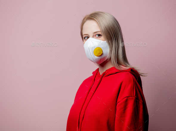 Woman in FFP2 anti-dust standart face mask