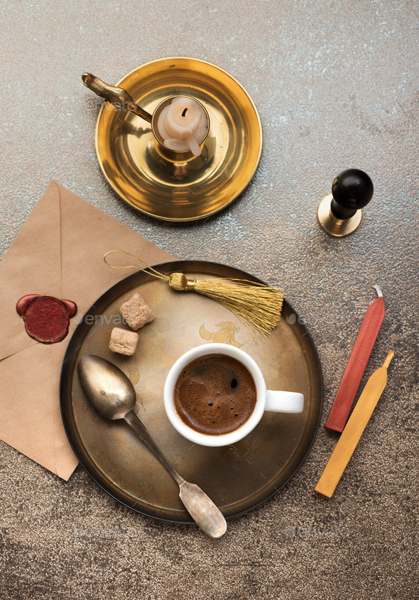 Cup espresso coffee, old envelope with red wax seal and wax stamp