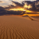 Sunset over the sand dunes in the desert. Arid landscape of the Sahara desert - PhotoDune Item for Sale