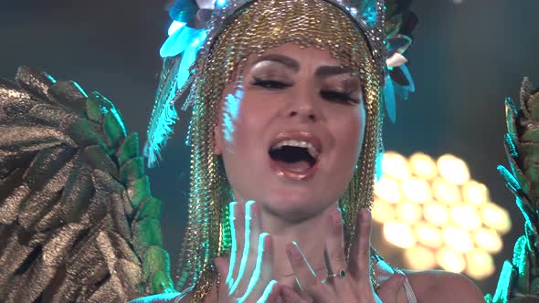 A Portrait of a Charming Actress in the Image of the Greek Goddess Artemis with a Golden Headdress alt