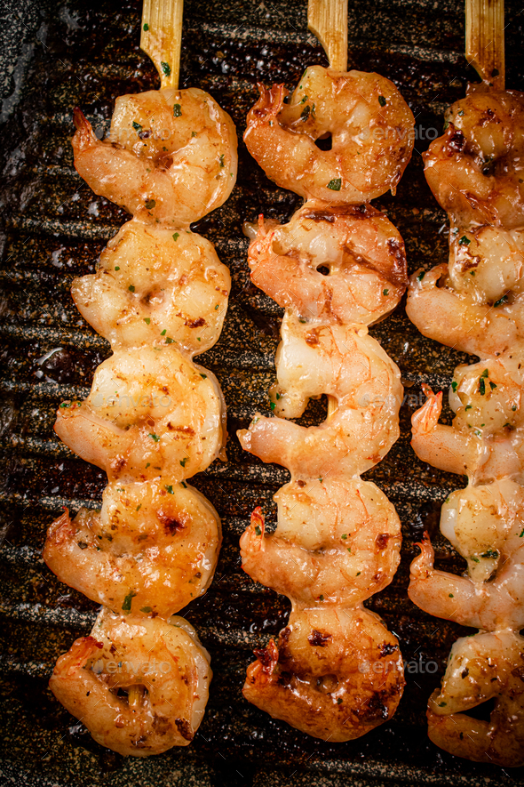 Grilled shrimp in a frying pan. Stock Photo by Artem_ka2 PhotoDune