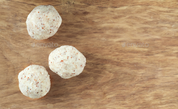 three coconut energy balls with almond. healthy sugar free concept. keto diet recipe.