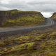 Icelandic road through lava fields and green moss. Travel freedom concept - PhotoDune Item for Sale
