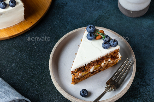 piece of carrot cake with walnuts and blueberry