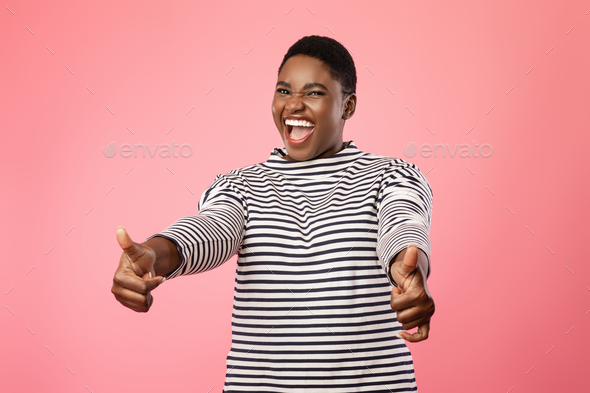 Excited Black Lady Showing Thumbs Up Gesture Over Pink Background