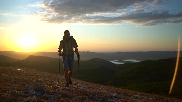 Young Male Traveler Climbing Mountain and Smiling While Traveling in Countryside Spbd alt