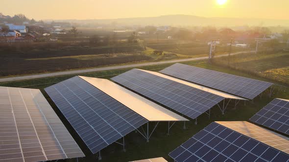 Aerial View of Large Sustainable Electrical Power Plant with Rows of Solar Photovoltaic Panels for alt