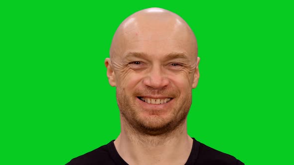 Cheerful Bald Man Making Happy Smiling Face on Green Screen