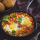 Shakshouka with eggs poached in a sauce of tomatoes and peppers - PhotoDune Item for Sale