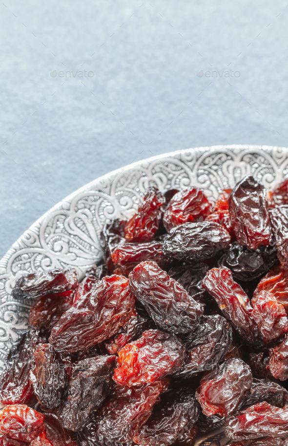 Sweet raisins in a bowl. - Stock Photo - Images