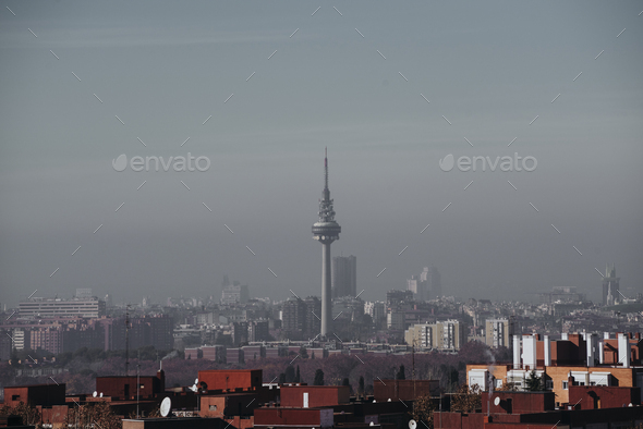 Madrid skyline from the air with pollution Stock Photo by karrastock