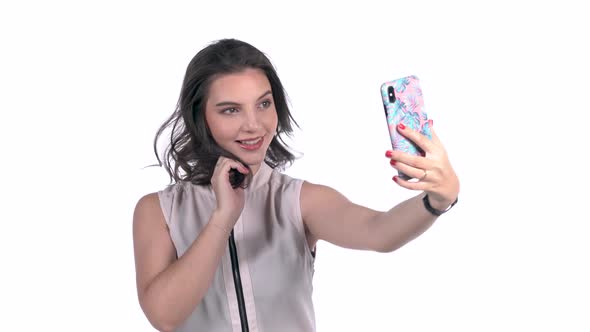 Sexy Young Woman Taking A Selfie On White Background Studio