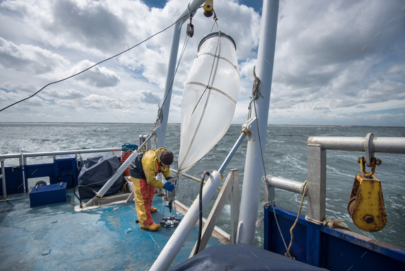 Scientist preparing plankton net on research ship Stock Photo by ...