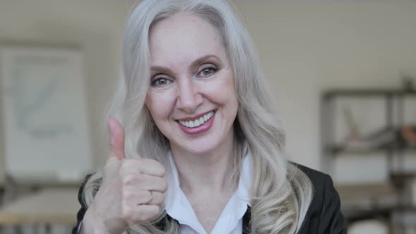 Thumbs Up by Middle Aged Business Woman alt