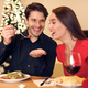 Smiling guy feeding his woman with pasta - PhotoDune Item for Sale