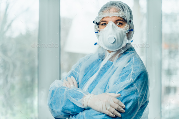 Portrait of woman doctor weaing protective suit during coronavirus pandemic