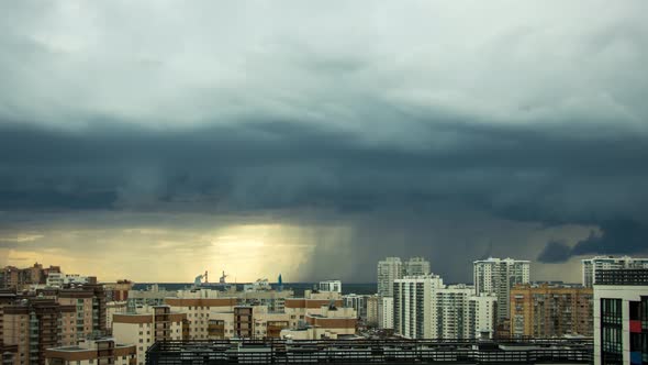 Thunderstorm Over the City Storm Clouds in a Storm Over the Residential Buildings of the City alt